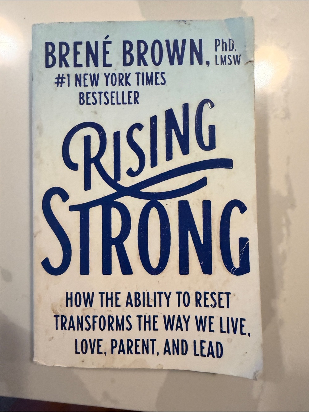 Rising Strong by Brené Brown - White & Navy Paperback
